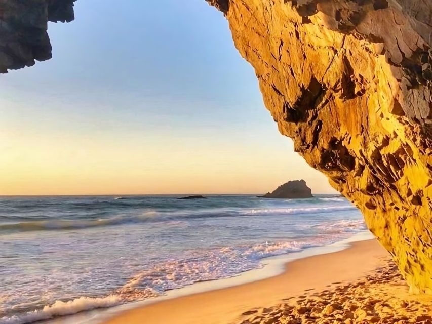 Lisbon Coast Tour: Paradise Beaches & Famous Beach Bars - Adraga Beach between tall cliffs: lounge setup and easy serenity