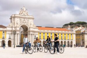 Lisbon: Guided Bike Tour, Helicopter Flight, and Boat Trip - Starting at Rossio: Praça Dom Pedro IV and the Barrio Alto rhythm