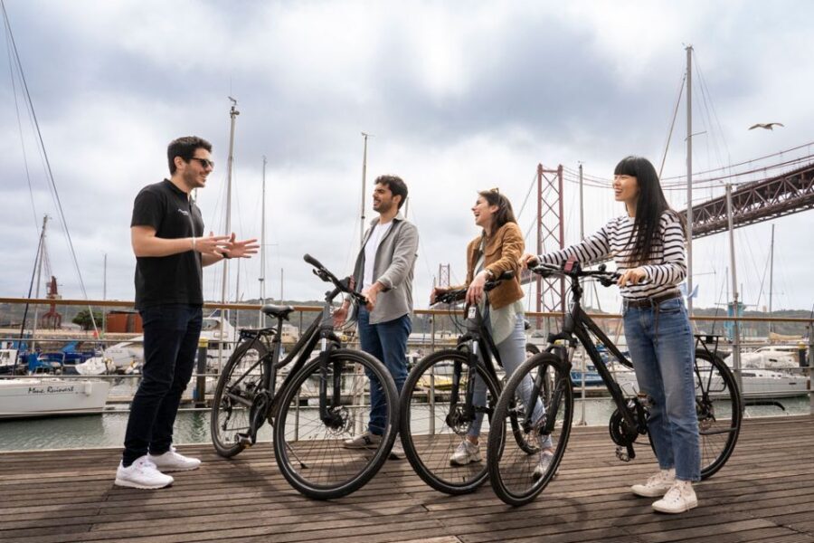 Lisbon: Guided Bike Tour, Helicopter Flight, and Boat Trip - On foot through Lisbon’s landmarks: St. Roque, Carmo, Alfama, and Praça do Comércio