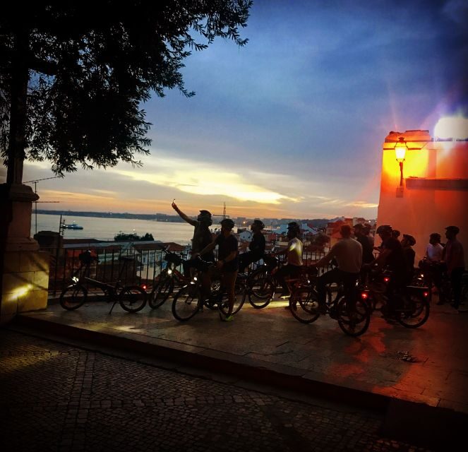 Lisbon: Guided Nighttime Electric Bike Tour - Riding up toward top sightseeing before the sunset