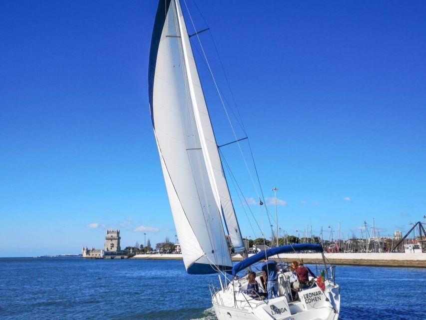 Lisbon: Yacht Sailing Tour With Portuguese Wine and History - 25 de Abril Bridge photo stop: wine first, views second, lessons third